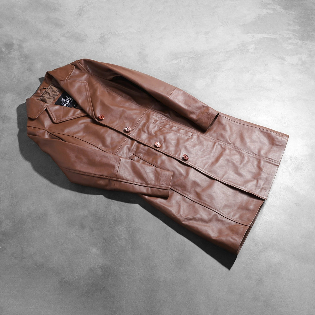 Open Hem &amp; Hem Craftsmanship Construction Detail on Women's Alice Brown Double Breasted Leather Coat