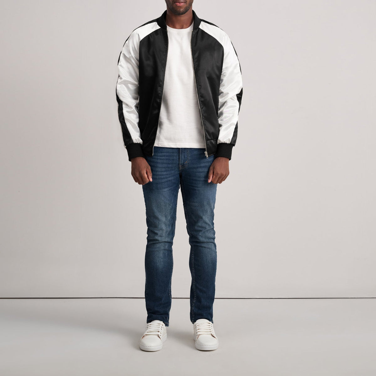 Close-Up Detail of Varsity & Zipper Hardware on Clarke Black Varsity Jacket