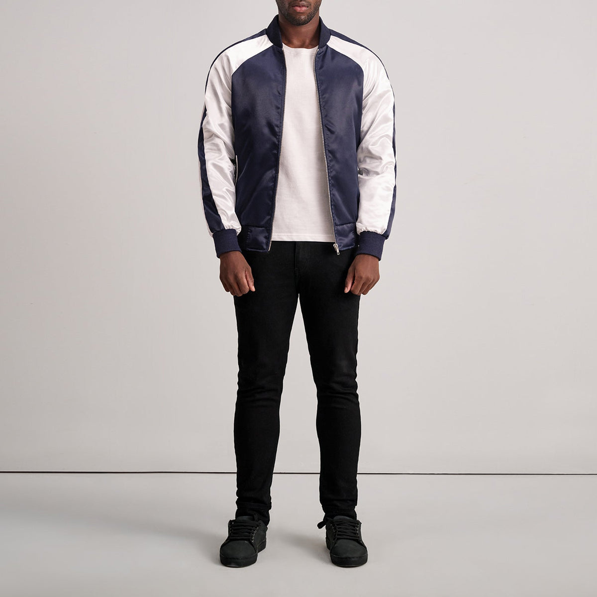 Close-Up Detail of Varsity &amp; Zipper Hardware on Clarke Blue Varsity Jacket
