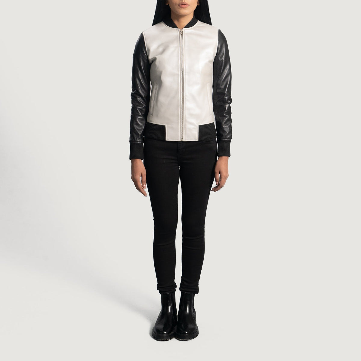 Close-Up Detail of Varsity &amp; Zipper Hardware on Women's Cole Silver Leather Bomber Jacket