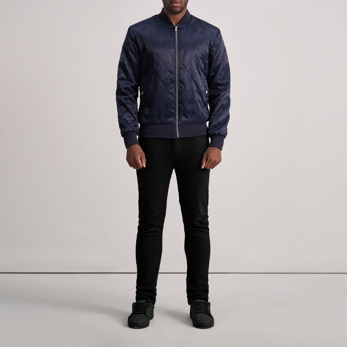 Close-Up Detail of Varsity &amp; Zipper Hardware on Danson Quilted Blue Varsity Jacket