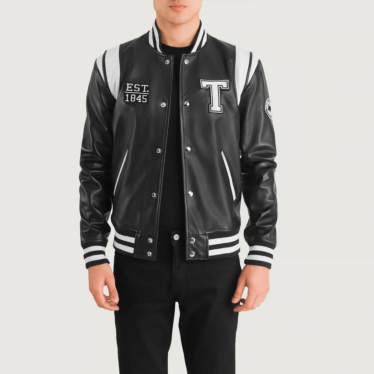 
Liberte Texas Black Leather Varsity Jacket in Black & White Sheepskin Leather - Front Profile View & Tailored Silhouette | Buy Online