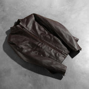 Zipper &amp; Hem Craftsmanship Construction Detail on Women's Rumella Maroon Leather Biker Jacket